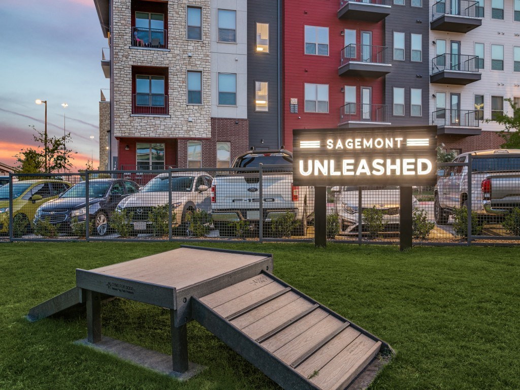 a picnic bench in front of an apartment building