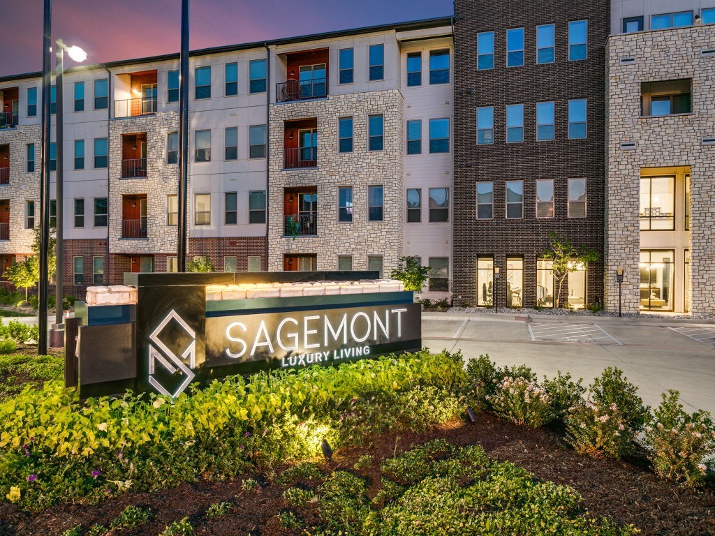 an exterior view of the sagemont building at night