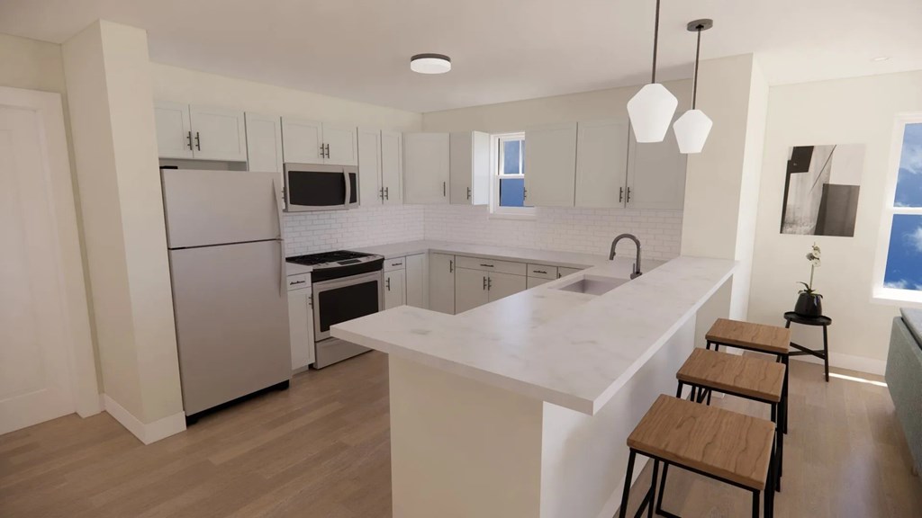 Spacious modern kitchen stainless steel appliances