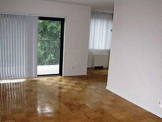 an empty living room with a sliding glass door