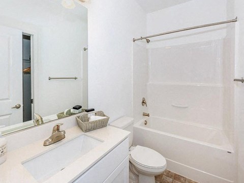a bathroom with a sink toilet and a shower