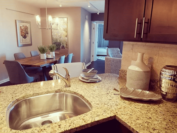 An open kitchen counter with a sink at Vista Condominiums, Kansas City, Kansas