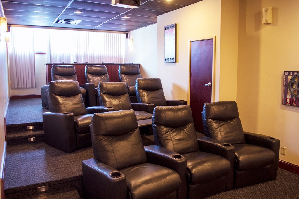 a room with leather chairs and a door