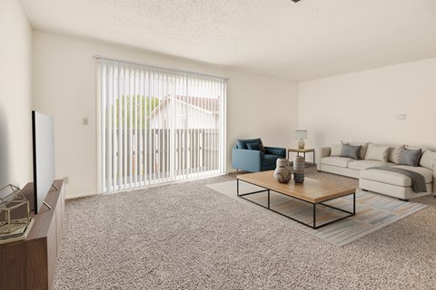 A living room with a blue chair and a white couch.