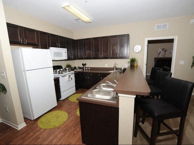 a kitchen with a counter and a refrigerator