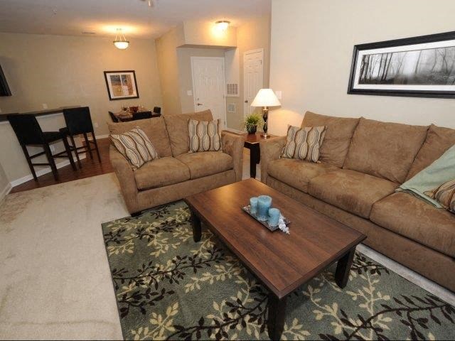 a living room with two couches and a coffee table