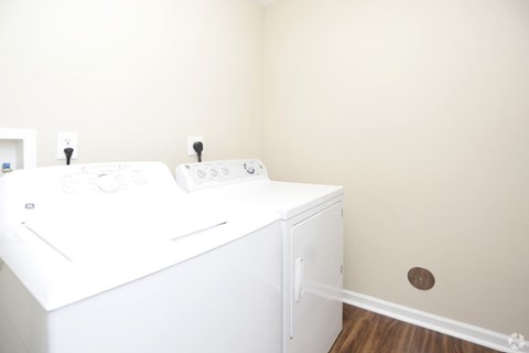 A white sink with a cabinet underneath it.