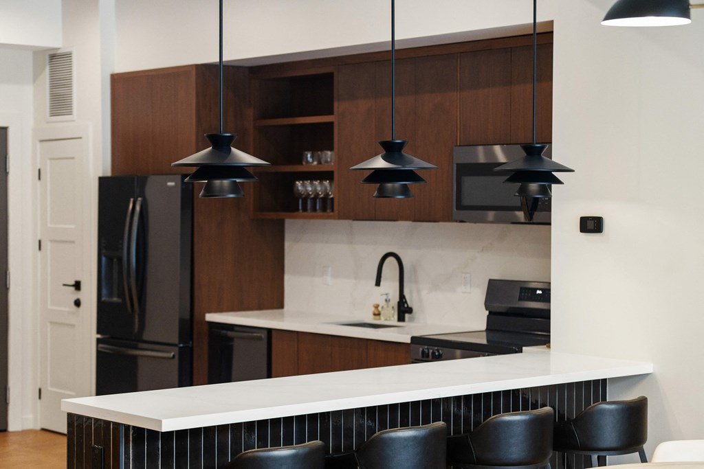 A kitchen and bar counter with stools at 2274 Princess St., Ontario, K7M 3G4