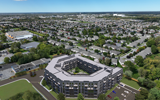 an aerial view of a large apartment complex with a large parking lot in the middle of it