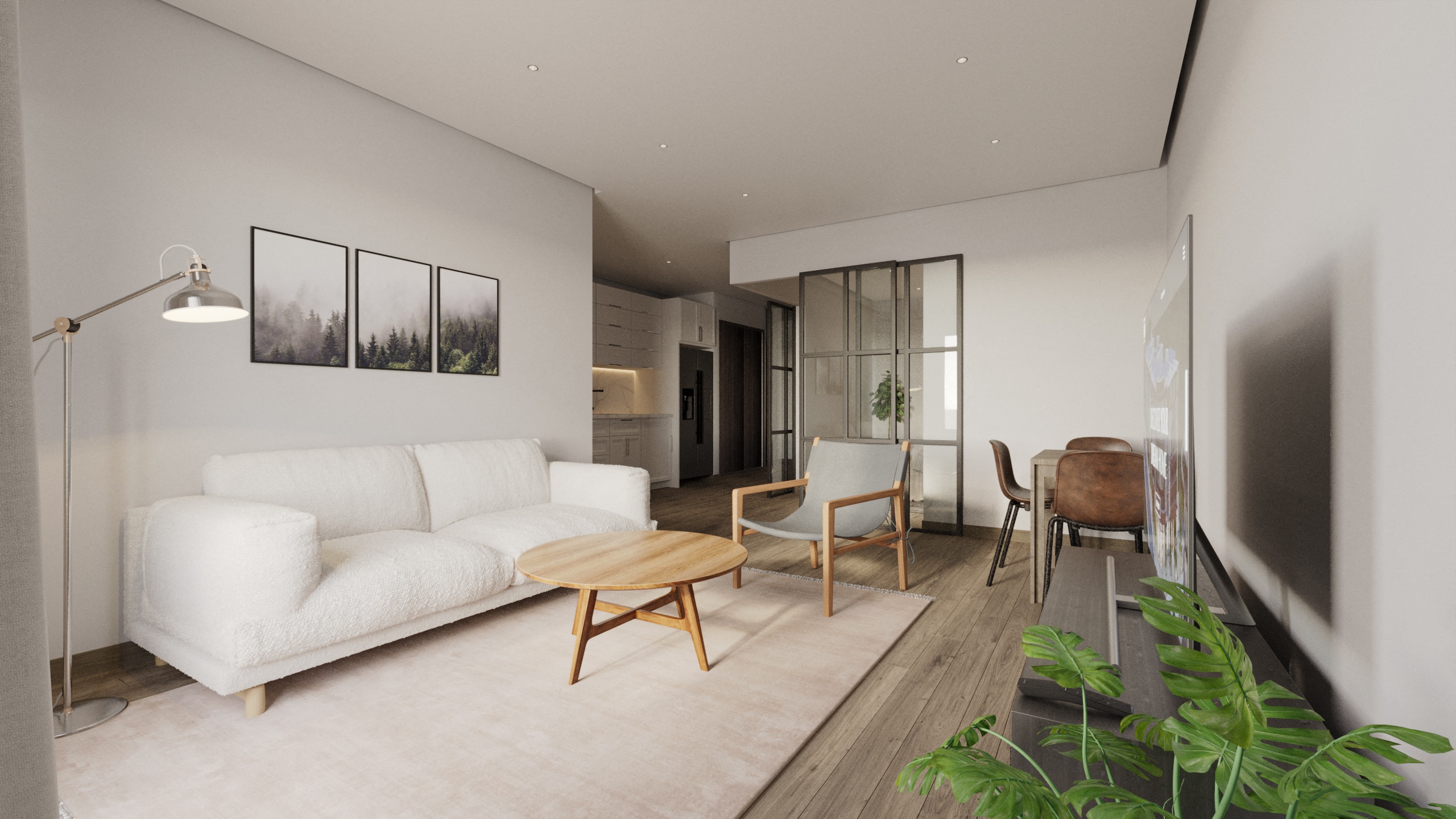 A white couch sits in a living room with a wooden coffee table in front of it.