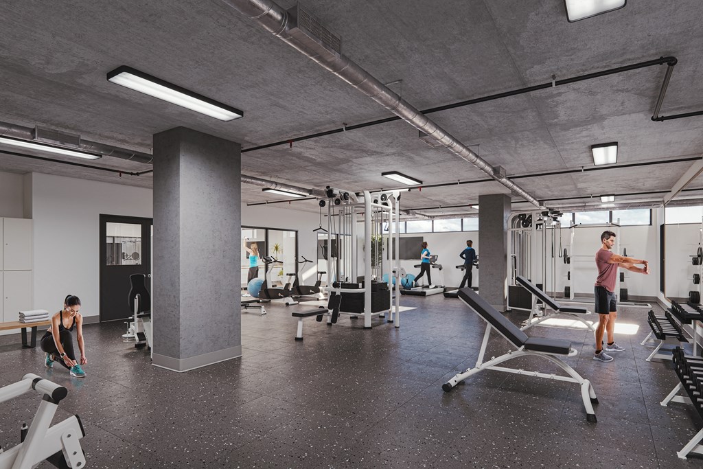 an image of a gym with people working out in it