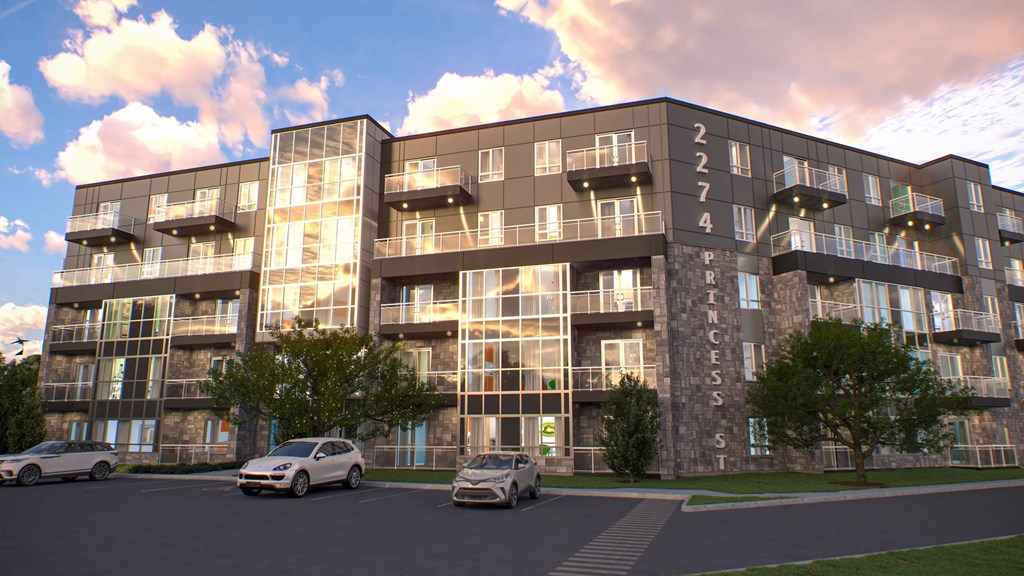 a rendering of a large apartment building with cars parked outside at 2274 Princess St., Kingston, ON