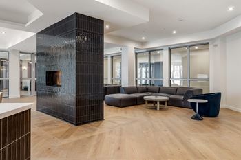 A modern living room with a fireplace and a large couch