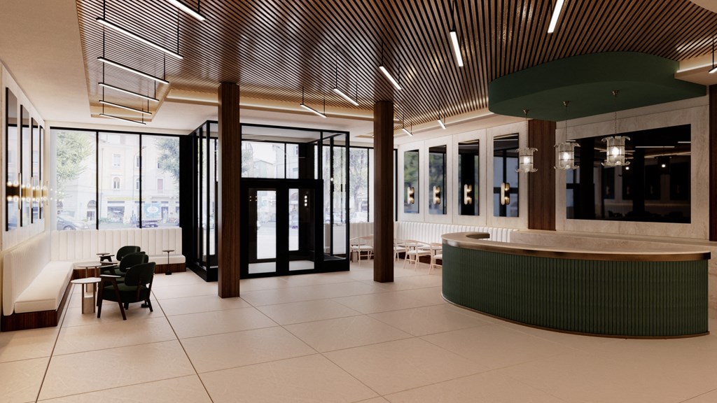 the lobby of a building with a reception desk and chairs at The Woods at 180 Kanata Avenue, Ontario