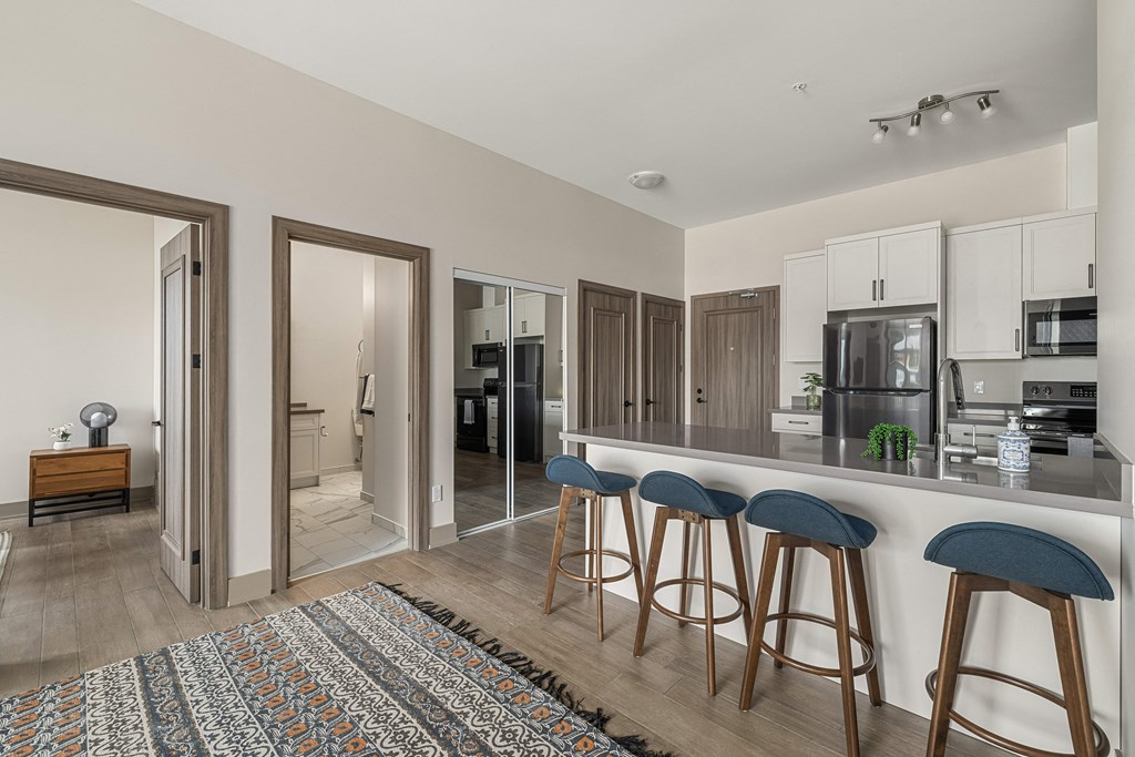 a kitchen with a bar and stools at 2274 Princess St., Kingston, ON