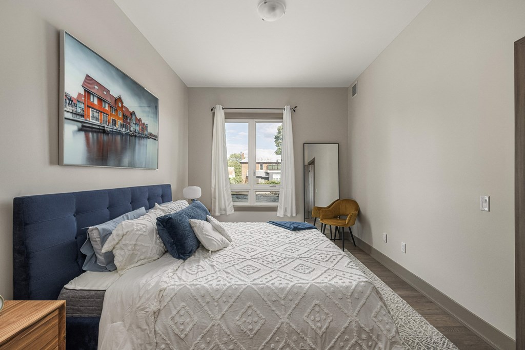 a bedroom with a large bed and a large window at 2274 Princess St., Kingston, ON, K7M 3G4