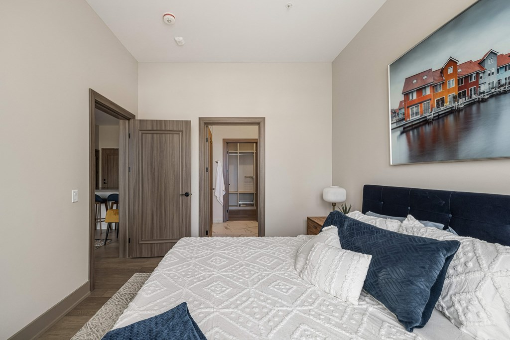 a bedroom with a large bed and a painting on the wall at 2274 Princess St., Kingston, Ontario