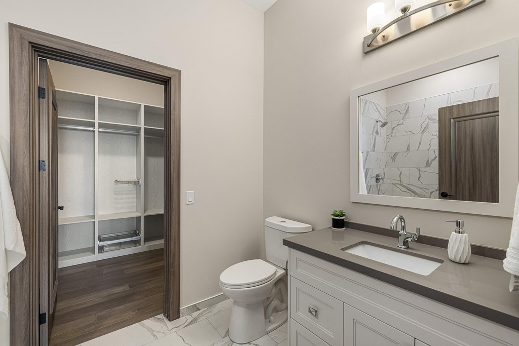 a bathroom with a toilet sink and shower at 2274 Princess St., Ontario, K7M 3G4