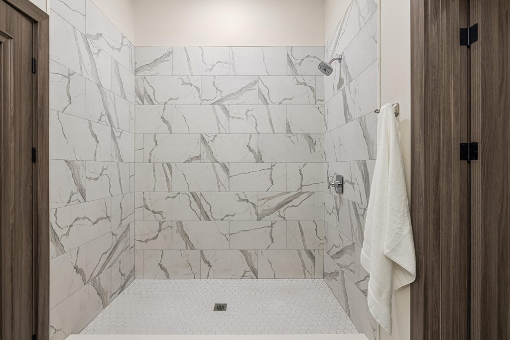 a bathroom with white tiles and a white shower curtain at 2274 Princess St., Ontario, K7M 3G4