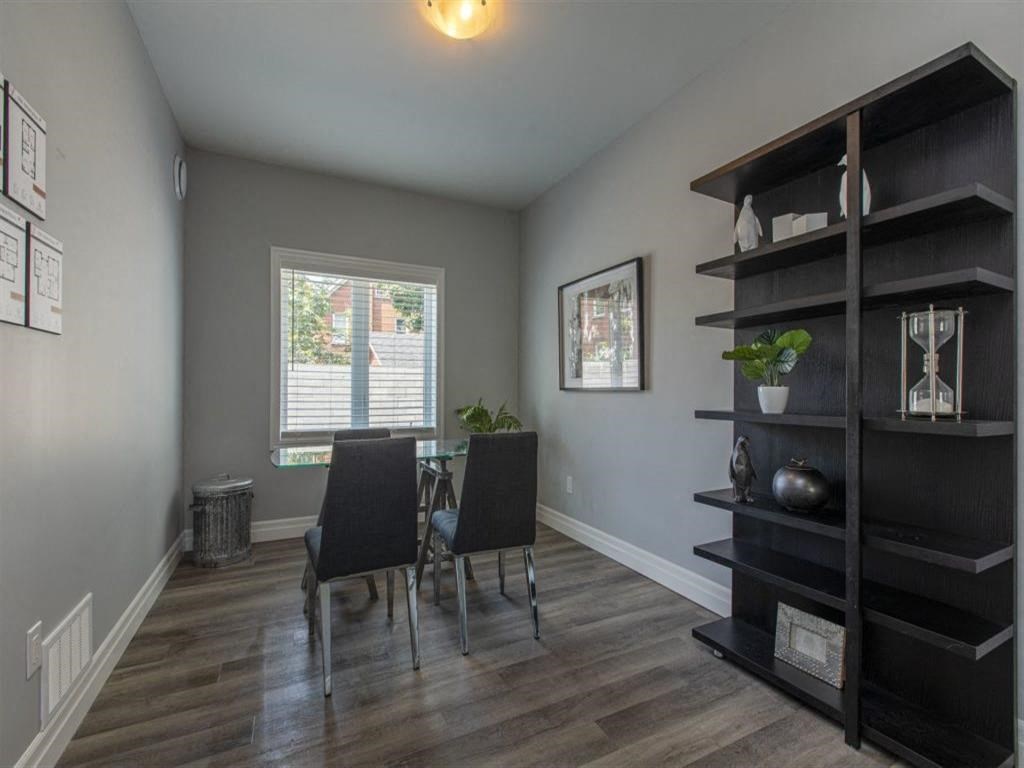 a dining room with a table and chairs