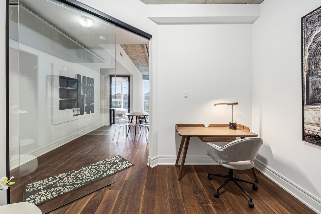 a home office with a desk and chair