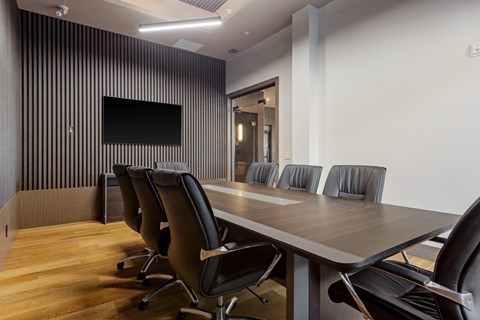 Conference Area with a long table and chairs at The Woods at 180 Kanata Avenue Apartments, Kanata, Ontario