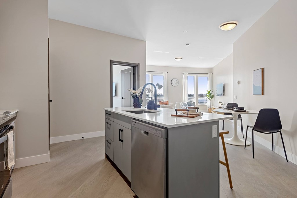 A kitchen with a refrigerator, oven, and sink at The Woods at 180 Kanata Avenue, Kanata, ON