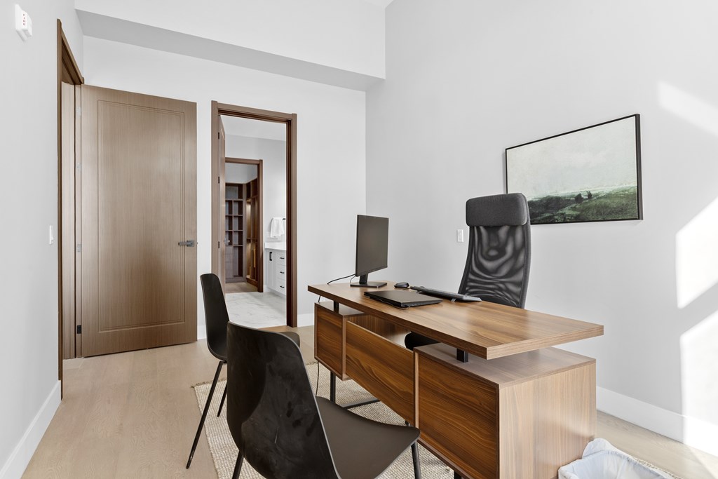 A room with a desk and a chair at The Woods at 180 Kanata Avenue, Kanata, Ontario, K2K 3L9