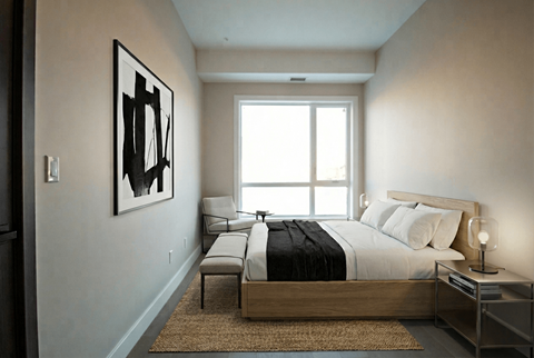 A bedroom with a large bed and a painting on the wall.