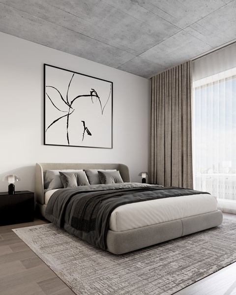A modern bedroom with a large bed and a framed picture on the wall.