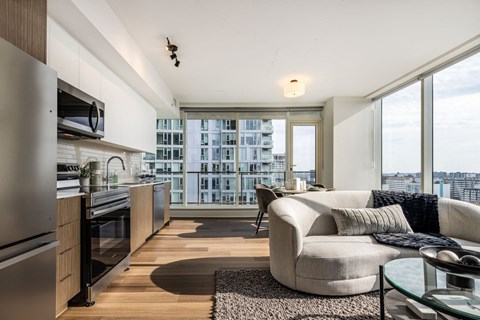 A modern kitchen with a view of the city.
