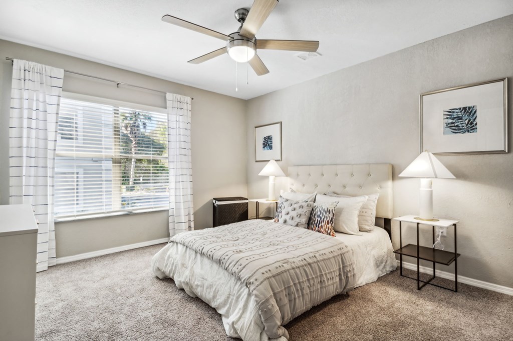 a bedroom with a bed and a ceiling fan at Reserve at Temple Terrace, Temple Terrace