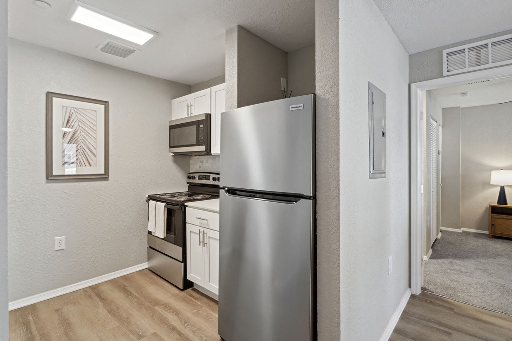 a kitchen with a refrigerator and a stove and a microwave at Reserve at Temple Terrace, Florida, 33637
