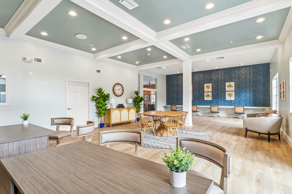 a living room with a table and chairs at Reserve at Temple Terrace, Temple Terrace