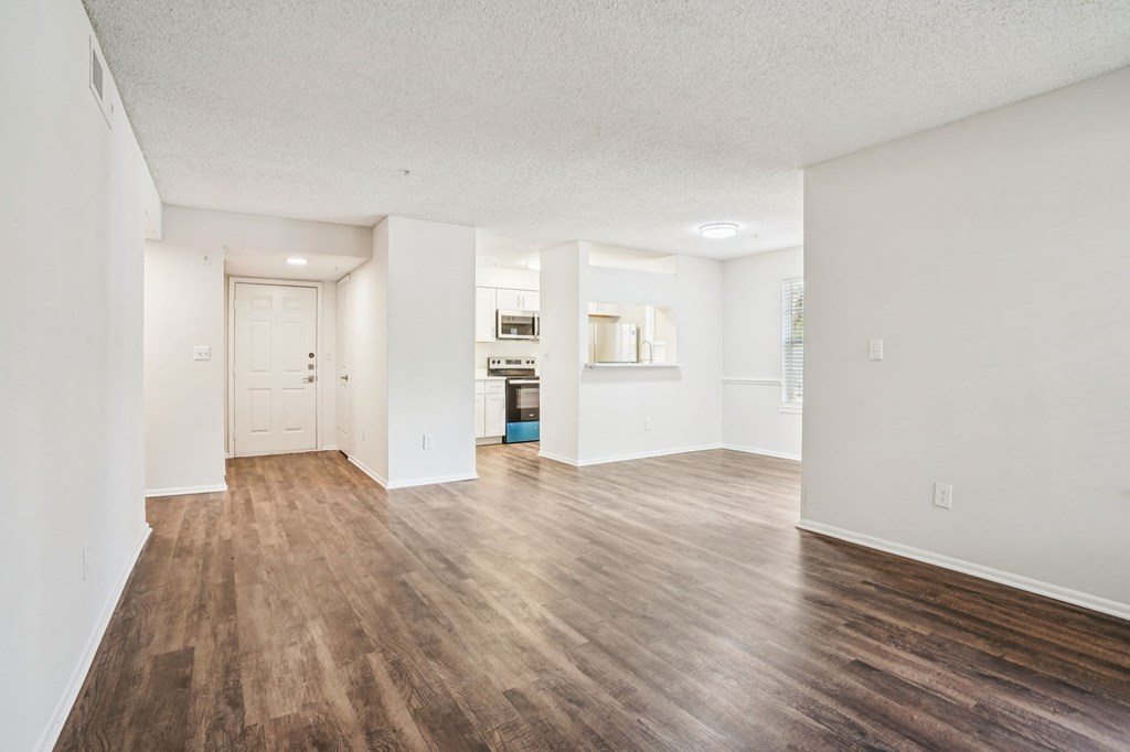A room with wooden floors and white walls.