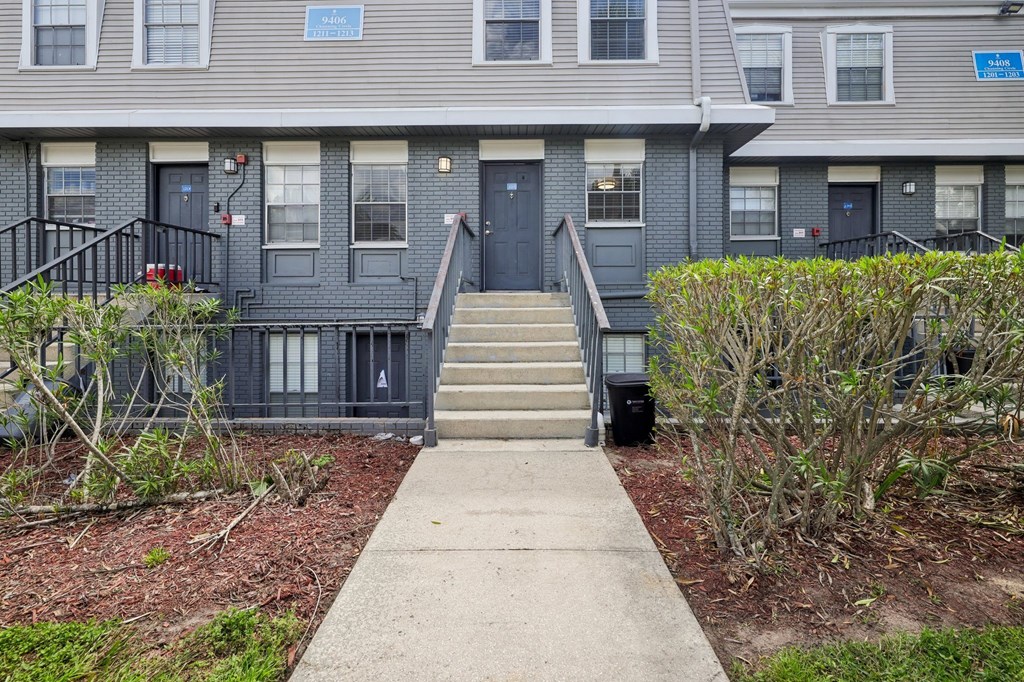 A building with a blue sign on the front door.
