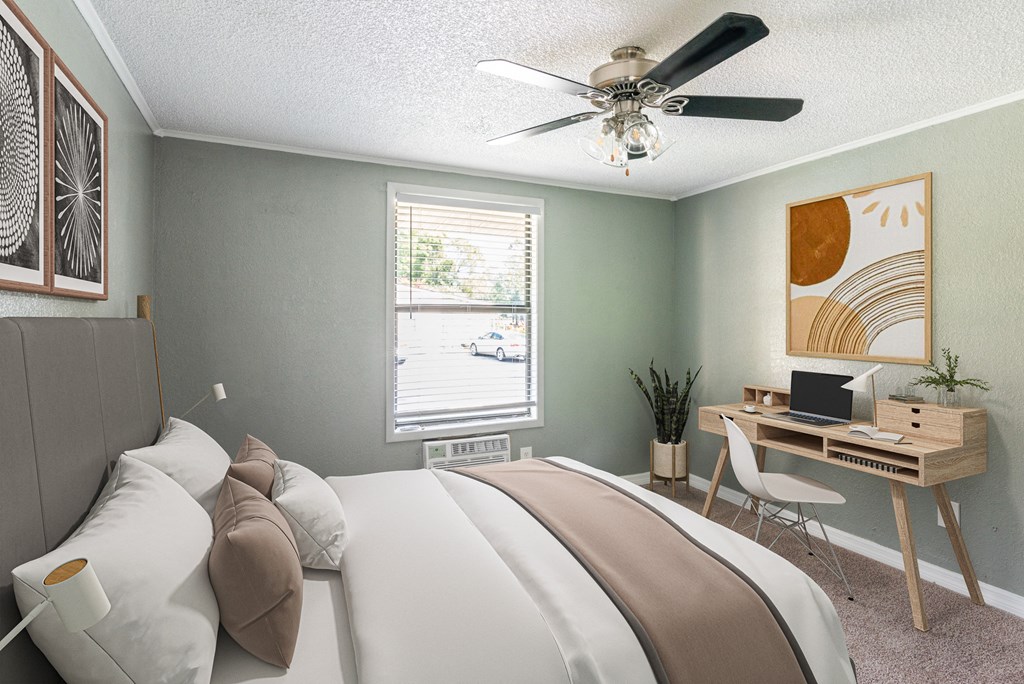 a bedroom with a bed and a ceiling fan
