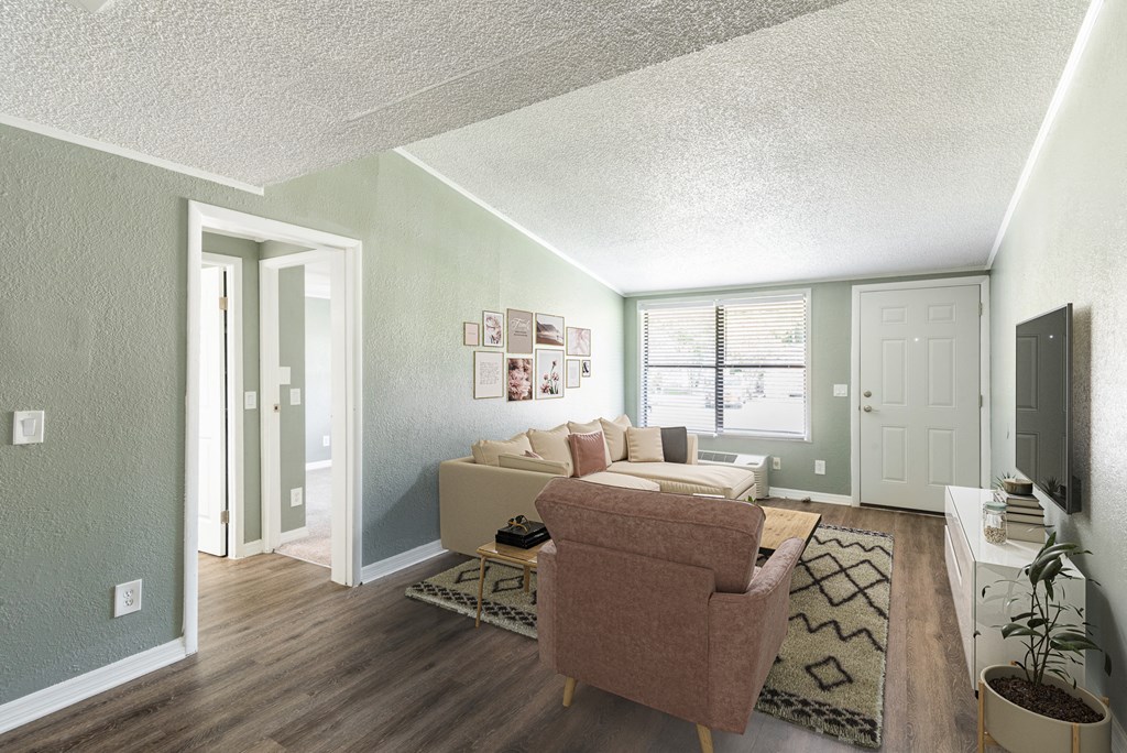 a living room with a couch and a tv