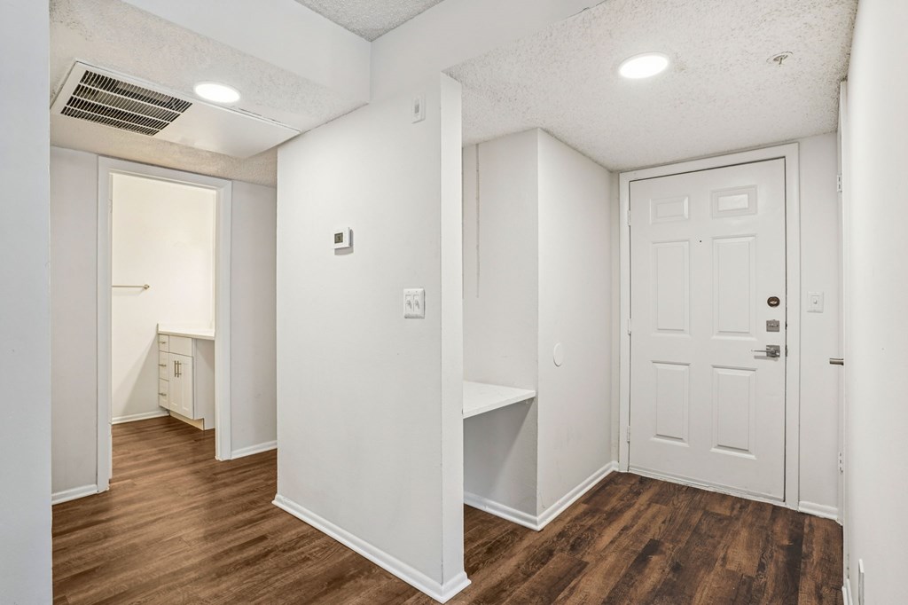 A white door is on the right side of the image.