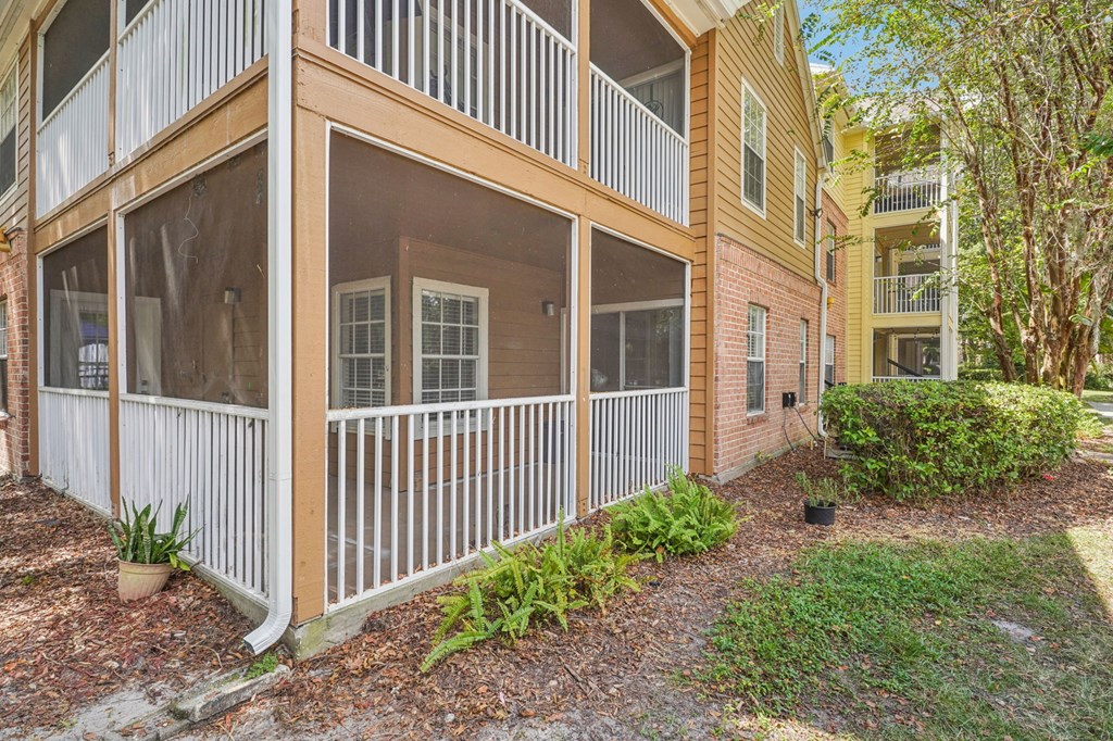 A building with a balcony and a white railing.