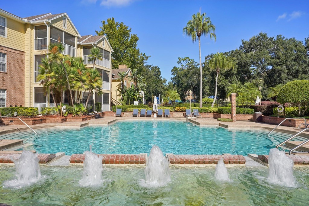 A pool with fountains in the middle of it.