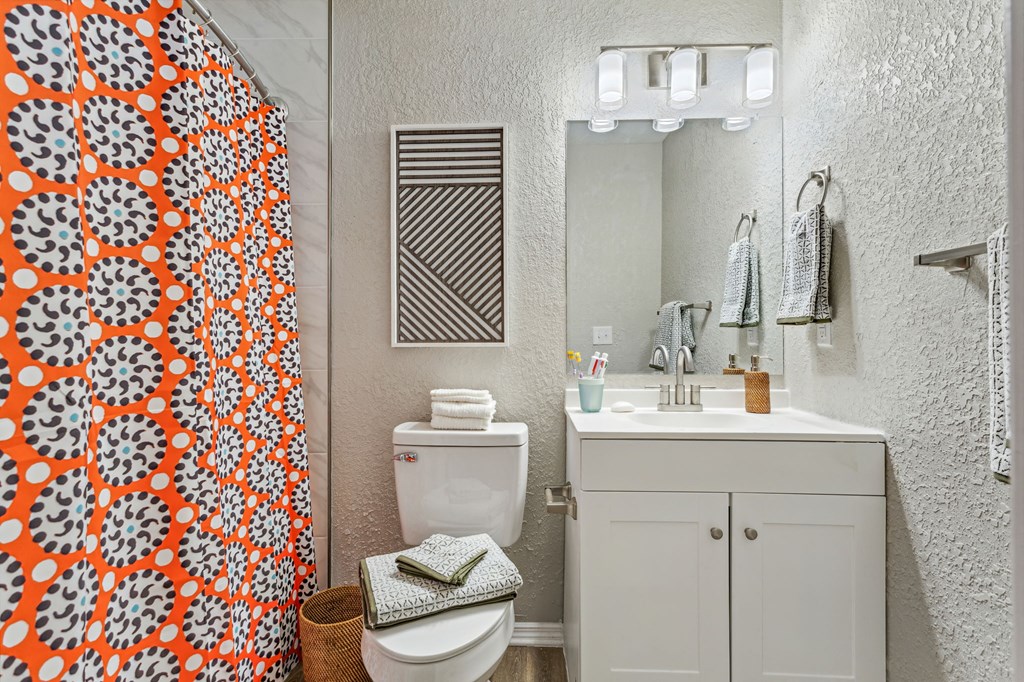 a bathroom with a shower and a toilet and a sink at Reserve at Temple Terrace, Temple Terrace