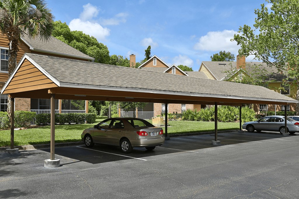 A carport with a car parked under it.