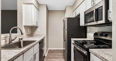 Granite Countertop Kitchen at Newport Colony Apartment Homes, Florida, 32707