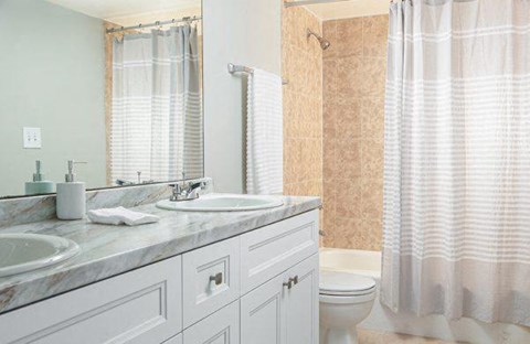 a bathroom with a sink and a toilet and a shower at Fairways of Inverrary, Lauderhill, FL, 33319