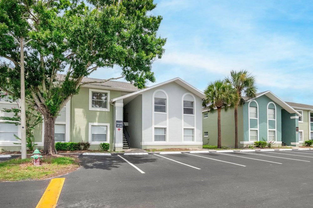 Exterior of apartment buildings with parking lot_Rolling Hills Apartments