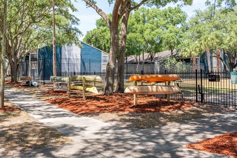 the preserve at ballantyne commons community picnic area with benches and trees  at Fisherman's Landing Apartment Homes, Tampa