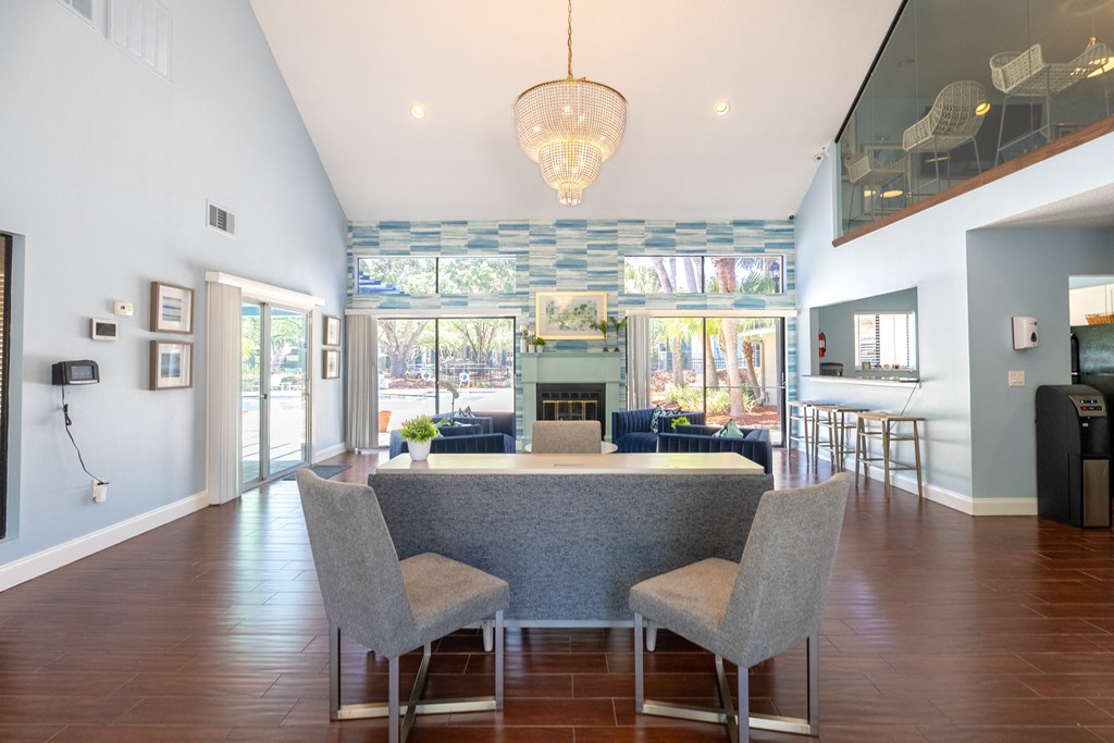 a dining room and living room with a table and chairs  at Fisherman's Landing Apartment Homes, Florida, 33637