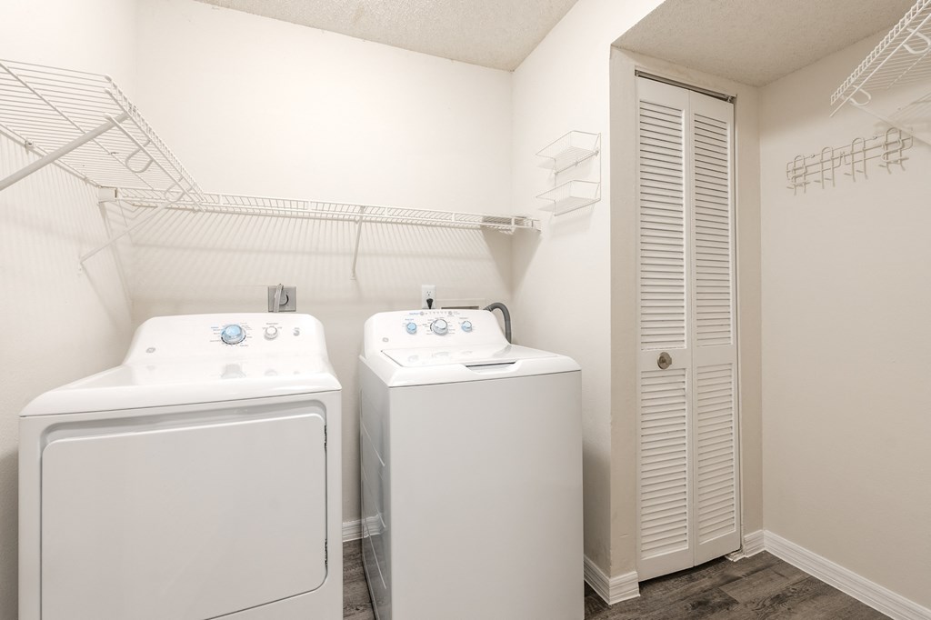 a laundry room with two washes and a dryer  at Fisherman's Landing Apartment Homes, Tampa, FL, 33637