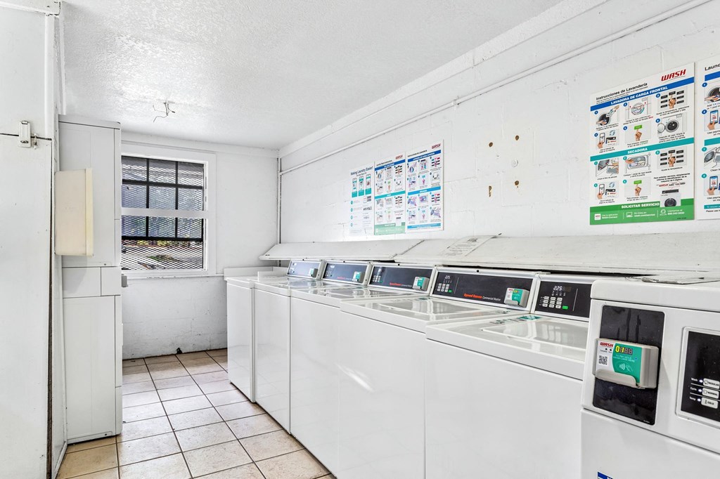 a kitchen with white appliances and a window at Greenwich Commons Apartment Homes, Tampa, Florida